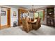 Traditional dining room featuring a wooden table, comfortable chairs, and a stylish chandelier at 386 Monte Vista Rd, Golden, CO 80401