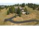 Beautiful hillside home featuring a two-car garage, mature trees and a winding driveway at 386 Monte Vista Rd, Golden, CO 80401