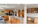 This kitchen features an island with counter seating and stainless appliances at 386 Monte Vista Rd, Golden, CO 80401