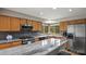Bright kitchen features granite countertops, stainless appliances, and wood floors at 386 Monte Vista Rd, Golden, CO 80401