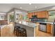 Kitchen boasts a large island, wood cabinets, and stainless appliances at 386 Monte Vista Rd, Golden, CO 80401