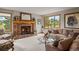 Bright living room features a brick fireplace and large window at 386 Monte Vista Rd, Golden, CO 80401