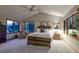 Main bedroom features a ceiling fan, sitting area, and large windows at 386 Monte Vista Rd, Golden, CO 80401