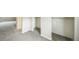 Spacious bedroom with new neutral carpeting and ample closet space at 6104 Hudson St, Commerce City, CO 80022
