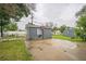 Detached garage with basketball hoop and extra parking space at 6104 Hudson St, Commerce City, CO 80022