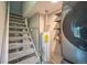 Laundry area with modern washer and dryer, next to a water heater at 6104 Hudson St, Commerce City, CO 80022