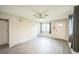Bright living room featuring hardwood floors and a ceiling fan at 6104 Hudson St, Commerce City, CO 80022