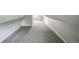 Room features gray carpet flooring, neutral walls, and slanted walls at 6104 Hudson St, Commerce City, CO 80022