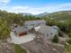 Stunning aerial view of the mountain home showcasing its architectural design and natural surroundings at 1055 Divide View Dr, Golden, CO 80403