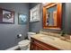 Stylish powder room featuring wood accents and neutral colors at 1055 Divide View Dr, Golden, CO 80403