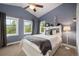 Charming bedroom with neutral carpet and a large window with a treed view at 1055 Divide View Dr, Golden, CO 80403