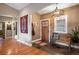 Inviting foyer showcasing wood floors, tiled entrance, and a rustic bench, creating a warm welcome at 1055 Divide View Dr, Golden, CO 80403