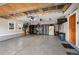 Spacious garage with epoxy flooring, workshop area, and ample storage solutions at 1055 Divide View Dr, Golden, CO 80403