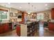 Spacious kitchen featuring stainless steel appliances, granite countertops, and a large center island at 1055 Divide View Dr, Golden, CO 80403