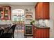 Kitchen featuring custom cabinets, granite countertops, and a wine cooler at 1055 Divide View Dr, Golden, CO 80403