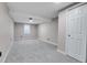 Basement bedroom with neutral carpet, a window for light, and ample closet space at 7054 Welch Ct, Arvada, CO 80004