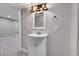 This bathroom features a modern vanity and lighting at 7054 Welch Ct, Arvada, CO 80004