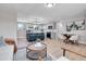 Open-concept living space seamlessly connects the kitchen, dining, and living areas with luxury vinyl flooring throughout at 7054 Welch Ct, Arvada, CO 80004