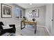 Bright home office featuring a modern desk, stylish decor, and a large window for natural light at 7054 Welch Ct, Arvada, CO 80004