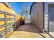 Property side yard with access to the backyard and driveway at 7054 Welch Ct, Arvada, CO 80004