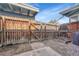 Fenced backyard space with a small garden and minimal landscaping at 264 S Newark Cir, Aurora, CO 80012