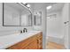 Bathroom features a vanity with a white countertop and a view of the shower and bathtub at 264 S Newark Cir, Aurora, CO 80012