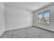 Sunlit bedroom with plush carpet and two windows offers ample natural light at 264 S Newark Cir, Aurora, CO 80012