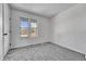 Bright bedroom with two windows and neutral carpet provides a calm, comforting space at 264 S Newark Cir, Aurora, CO 80012