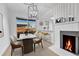 Dining room featuring a white marble table, a modern chandelier, and light wood floors at 264 S Newark Cir, Aurora, CO 80012