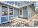 Exterior view of the townhome, showcasing the front entrance and blue siding at 264 S Newark Cir, Aurora, CO 80012