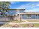 Exterior view of a townhome with well-maintained landscaping and blue siding at 264 S Newark Cir, Aurora, CO 80012