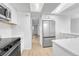 Bright kitchen with stainless steel appliances and ample counter space at 264 S Newark Cir, Aurora, CO 80012