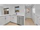 Bright modern kitchen featuring stainless steel appliances and light wood floors at 264 S Newark Cir, Aurora, CO 80012