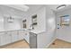 Bright kitchen featuring stainless steel appliances and quartz countertops at 264 S Newark Cir, Aurora, CO 80012