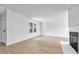 Spacious living room with light wood floors and a fireplace at 264 S Newark Cir, Aurora, CO 80012