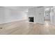 Bright living room with wood flooring and a cozy fireplace, providing a blank canvas for personalization at 264 S Newark Cir, Aurora, CO 80012