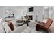 Bright living room featuring a fireplace and light wood floors at 264 S Newark Cir, Aurora, CO 80012