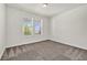 Bright bedroom with neutral carpet, large windows and ample natural light at 8772 S Sicily Ct, Aurora, CO 80016