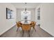 Dining room featuring modern light fixture and hardwood floors at 8772 S Sicily Ct, Aurora, CO 80016