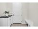 Entryway featuring a white door, small bench and plant at 8772 S Sicily Ct, Aurora, CO 80016