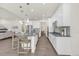 Modern kitchen with stainless steel appliances and a large center island with seating at 8772 S Sicily Ct, Aurora, CO 80016