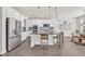 Eat-in kitchen with large island, stainless steel appliances, and pendant lighting at 8772 S Sicily Ct, Aurora, CO 80016