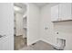 Laundry room with washer/dryer hookups, closet, and a cabinet at 8772 S Sicily Ct, Aurora, CO 80016
