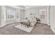 Spacious bedroom with tray ceiling, large windows, and neutral decor at 8772 S Sicily Ct, Aurora, CO 80016