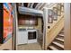 Basement laundry area with modern washer and dryer beside basement stairway at 5225 S Everett Ct, Littleton, CO 80123