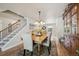 Light-filled dining room with stylish decor, chandelier, and hardwood flooring at 5225 S Everett Ct, Littleton, CO 80123