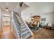 Inviting foyer with stairs, hardwood floors, and dining area with elegant furnishings at 5225 S Everett Ct, Littleton, CO 80123