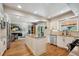 Spacious kitchen features an island, modern appliances, and a seamless transition to the living room at 5225 S Everett Ct, Littleton, CO 80123