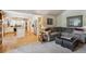 Open concept living room seamlessly connects to the kitchen with modern finishes and furniture at 5225 S Everett Ct, Littleton, CO 80123