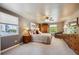 Serene bedroom with plush carpeting, ample natural light, and a ceiling fan for added comfort at 5225 S Everett Ct, Littleton, CO 80123